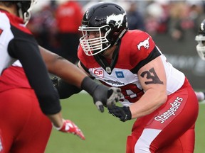 Calgary Stampeders wide receiver Jamal Nixon (80) has a #31 on his arm in honour of his teammate Mylan Hicks during pre-game warm-ups before CFL football action against the Hamilton Tiger-Cats in Hamilton, Ont., on Saturday, October 1, 2016. Milan Hicks, who wore #31, was killed in a shooting outside a Calgary bar last week.