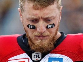 Calgary Stampeders quarterback Bo Levi Mitchell (19) wears the number and initials of teammate Mylan Hicks during the first-half of CFL football action in Hamilton, Ont., on Saturday, October 1, 2016. Milan Hicks, who wore #31, was killed in a shooting outside a Calgary bar last week. THE CANADIAN PRESS/Peter Power ORG XMIT: PMP112