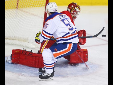 Calgary Flames Brian Elliott makes a save on a shot by Mark Letestu  of the Edmonton Oilers during NHL hockey in Calgary, Alta., on Friday, October 14, 2016. AL CHAREST/POSTMEDIA