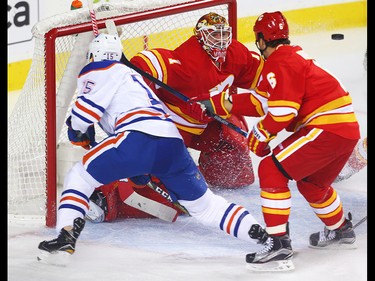 Calgary Flames Brian Elliott makes a save on a shot by Tyler Pitlick of the Edmonton Oilers during NHL hockey in Calgary, Alta., on Friday, October 14, 2016. AL CHAREST/POSTMEDIA