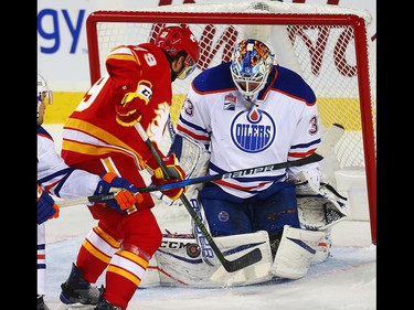 Edmonton Oilers Cam Talbot makes a save on a shot by Micheal Ferland of the Calgary Flames during NHL hockey in Calgary, Alta., on Friday, October 14, 2016. AL CHAREST/POSTMEDIA