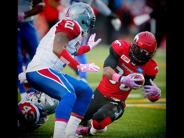 Calgary Stampeders Anthony Parker with a touchdown against Jovon Johnson and the Montreal Alouettes during CFL football in Calgary, Alta., on Saturday, October 15, 2016. AL CHAREST/POSTMEDIA