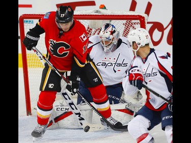 Calgary Flames Lance Bouma looks to tip the puck by goalie Braden Holtby of the Washington Capitals during NHL hockey in Calgary, Alta., on Sunday, October 30, 2016.