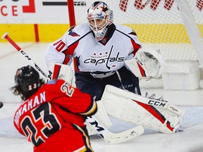 Calgary Flames Sean Monahan with a shot on Washington Capitals goalie Braden Holtby during NHL hockey in Calgary, Alta., on Sunday, October 30, 2016. AL