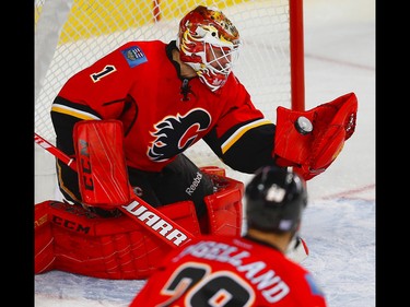 Calgary Flames Brian Elliott with a save against the Washington Capitals during NHL hockey in Calgary, Alta., on Sunday, October 30, 2016.