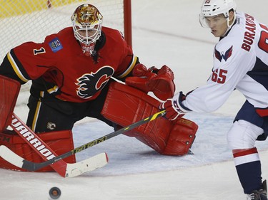 Calgary Flames Brian Elliott with a save against the Washington Capitals during NHL hockey in Calgary, Alta., on Sunday, October 30, 2016.