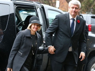 Former prime minister Stephen Harper and his wife Laureen arrive at the state memorial for Jim Prentice on Friday.