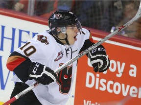 Hitmen Jakob Stukel celebrates his second period goal during WHL action between the Lethbridge Hurricanes and the Calgary Hitmen in Calgary, Alta at the Scotiabank Saddledome on Wednesday December 30, 2015.