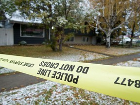 Police tape surrounds a home at the corner of 19th Street and McGonical Drive N.E. after an overnight home invasion.