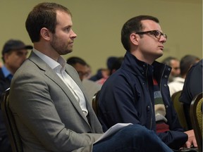 Jean-Christophe De Le Rue, senior communications associate for Uber in Canada, and Michael Van Hemmen, public policy manager for Uber, listen to the Livery Transport Advisory Committee at the Clarion Hotel in Calgary, Alta., on Thursday, Oct. 20, 2016. Elizabeth Cameron/Postmedia