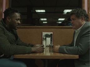 Jesse Lipscombe and Aaron Douglas in a scene and from the film In Plainview