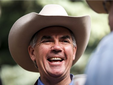 Alberta PC Party leadership candidate Jim Prentice talks with constituents at a Stampede breakfast in Calgary, Alta., Monday, July 7, 2014.