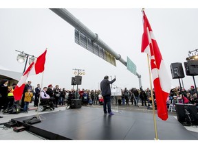 Mayor Naheed Nenshi speaks during the ceremonial opening of the Flanders Interchange bridge over Crowchild Trail SW in Calgary, Alta., on Saturday, Oct. 29, 2016. The new bridge, featuring two roundabouts instead of traffic lights, will be open to vehicle traffic on Monday; the entire project is expected to be complete in Summer 2017. Lyle Aspinall/Postmedia Network