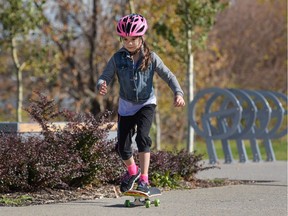 McKenna Pineda, 8, skateboards near St. Patrick's Island in Calgary, Alta., on Sunday, Oct. 2, 2016.