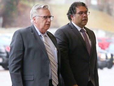 Calgary Coun. Jim Stevenson and Mayor Naheed Nenshi arrive at the memorial for Jim Prentice. Jim Wells/Postmedia