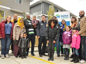 New owners of homes by Habitat for Humanity Southern Alberta in Pineridge, Calgary.