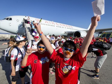 Nicco Cruz, 9, and Jayden Potterface (L), 9, celebrate after landing with Dreams Take Flight at LAX in Los Angeles, California, on Wednesday, Oct. 19, 2016. Dreams Take Fight Calgary took 150 kids deserving a break from difficult situations for a one-day trip to the Magical Kingdom. It was Air Canada's 24th year for its charity event. Lyle Aspinall/Postmedia Network