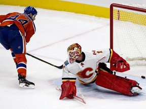 The Edmonton Oilers' Zack Kassian (44) scores on the Calgary Flames' goalie Brian Elliott (1) during first period NHL action at Rogers Place, in Edmonton on Wednesday Oct. 12, 2016. Photo by David Bloom Photos off Oilers game for multiple writers copy in Oct. 13 editions.