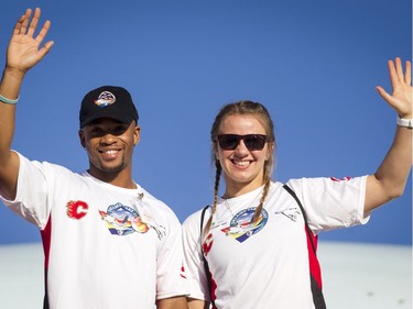 Olympic bronze medallist Akeem Haynes and gold medallist Erica Wiebe wave after disembarking a Dreams Take Flight jet at LAX in Los Angeles, California, on Wednesday, Oct. 19, 2016. Dreams Take Fight Calgary took 150 kids deserving a break from difficult situations for a one-day trip to the Magical Kingdom. It was Air Canada's 24th year for its charity event. Lyle Aspinall/Postmedia Network