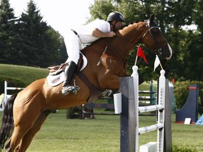 Keean White rides Unari van de Wolfsakker in the $10,000 Open at the National Capital Show Jumping Classic in Ottawa, August 13, 2010.