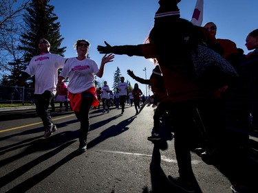 Participants cruise to the finish line in the Canadian Breast Cancer Foundation CIBC Run for the Cure at Southcentre Mall in Calgary, Alta., on Sunday, Oct. 2, 2016.