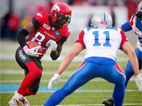 Calgary Stampeders DaVaris Daniels runs the against Chip Cox and Bear Woods of the Montreal Alouettes during CFL football in Calgary, Alta., on Saturday, October 15, 2016.