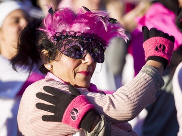 Qasira Shaheen warms up before the start of the Canadian Breast Cancer Foundation CIBC Run for the Cure at Southcentre Mall in Calgary, Alta., on Sunday, Oct. 2, 2016. About 7,500 people took part in the 5-km and 1-km runs. Lyle Aspinall/Postmedia Network