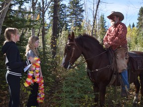 Alexa Imbea, left, Eve Pigat, and Ranch Tracker Joel Martens.