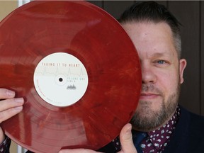 Ryan Montemurro poses in Calgary, Alta on Friday Sept. 23, 2016 with a copy of the LP featuring local and Canadian acts as a fundraiser for the Heart and Stroke Foundation of Canada.