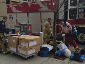 Calgary Fire Department unload hazmat material outside Calgary Courts Centre. Oct. 13, 2015