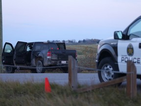 Police at the scene of an officer-involved shooting early Tuesday morning near the intersection of 12 Mile Coulee Road and Bluridge Rise N.W.