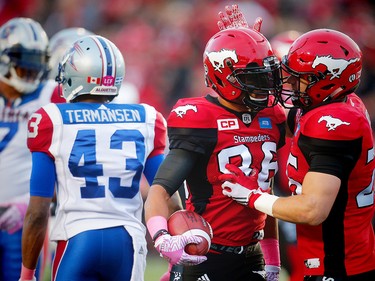 Calgary Stampeders Anthony Parker celebrates with teammate Rob Cote after his touchdown against the Montreal Alouettes during CFL football in Calgary, Alta., on Saturday, October 15, 2016. AL CHAREST/POSTMEDIA