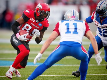 Calgary Stampeders DaVaris Daniels runs the against Chip Cox and Bear Woods of the Montreal Alouettes during CFL football in Calgary, Alta., on Saturday, October 15, 2016. AL CHAREST/POSTMEDIA