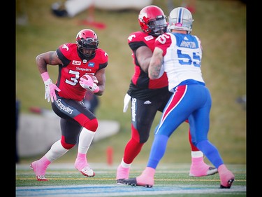 Calgary Stampeders Derek Dennis blocks Gabriel Knapton of the Montreal Alouettes as Jerome Messam runs the ball during CFL football in Calgary, Alta., on Saturday, October 15, 2016. AL CHAREST/POSTMEDIA