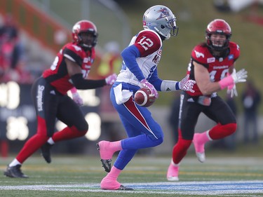 Montreal Alouettes quarterback Rakeem Cato scrambles under pressure from the Calgary Stampeders defence during CFL football in Calgary, Alta., on Saturday, October 15, 2016. AL CHAREST/POSTMEDIA