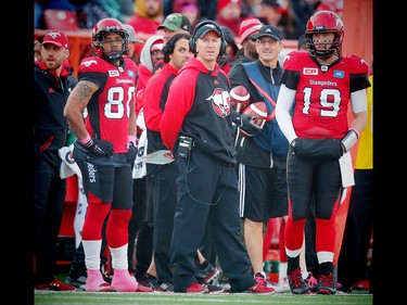 Calgary Stampeders head coach Dave Dickenson and quarterback  Bo Levi Mitchell on the sidelines during a game against the Montreal Alouettes in Calgary, Alta., on Saturday, October 15, 2016. AL CHAREST/POSTMEDIA