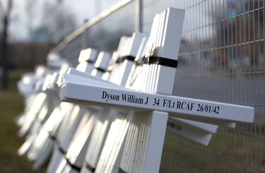 Crosses rest against a fence during the set-up at the Field of Crosses Memorial Project in Calgary, Alta on Saturday October 22, 2016 near Memorial Dr and Centre St NW. Starting November 1st to November 11th, over 3,200 crosses are being displayed on a 5 acre city park in military cemetery formation to memorialize southern Alberta soldiers who were killed in action.  Each cross is inscribed with the name, age at death, rank, regiment and date of death of a soldier who lost his or her life in a foreign land, fighting for the freedoms we all enjoy today. Jim Wells/Postmedia