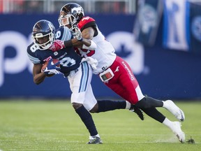 Toronto Argonauts Kenny Shaw and Calgary Stampeders Tommie Campbell during 1st half CFL action at BMO Field in Toronto, Ont. on Monday October 10, 2016.