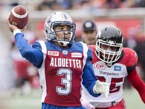 Montreal Alouettes quarterback Vernon Adams Jr. gets set to pass as he is chased by Calgary Stampeders lineman Micah Johnson during second quarter CFL football action Sunday, October 30, 2016 in Montreal.