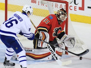 Calgary Flames goaltender Chad Johnson stops this  Toronto Maple Leafs scoring chance in the first period of NHL action at the Scotiabank Saddledome in Calgary on Wednesday November 30, 2016.