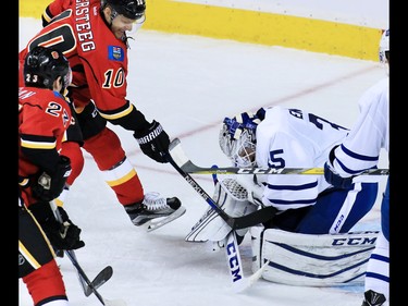 Toronto Maple Leafs goaltender Jhonas Enroth stops Calgary Flames forward Kris Versteeg during the second period of NHL action at the Scotiabank Saddledome in Calgary on Wednesday November 30, 2016.