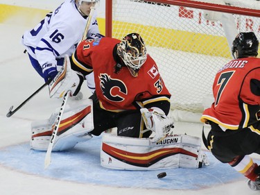 The Calgary Flames goaltender Chad Johnson stops this shot in the third period of a 3-0 shut out against the Toronto Maple Leafs at the Scotiabank Saddledome in Calgary on Wednesday November 30, 2016.