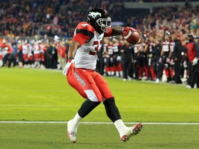 TORONTO, ON - NOVEMBER 27:  Jerome Messam #33 of the Calgary Stampeders runs in a touchdown during the first half of the 104th Grey Cup Championship Game against the Ottawa Redblacks at BMO Field on November 27, 2016 in Toronto, Canada.