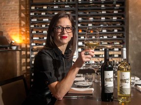 Leslie Echino (and her friend Mark Kuspira) are selling glasses of an exclusive wine to raise money for Hospice Calgary.