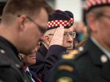 A Calgary Highlanders veteran salutes to the bugler at the cenotaph at Central Memorial Park for Remembrance Day ceremonies in Calgary, Ab., on Friday November 11, 2016.