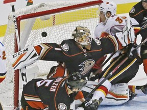 Calgary Flames right winger Alex Chiasson (39) pushes the puck past Anaheim Ducks goalie Jonathan Bernier (1) in the first period of an NHL hockey game in Anaheim, Calif., Sunday, Nov. 6, 2016.
