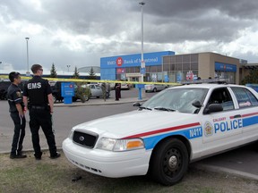 The scene of a police shooting at the Bank of Montreal in Calgary, Alberta on May 14, 2013. For City story by ? (Leah Hennel/Calgary Herald)