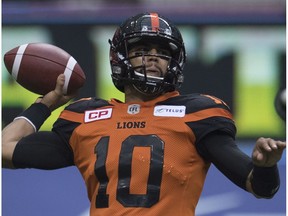 BC Lions quarterback Jonathon Jennings (10) prepares to make a throw during the first half of CFL football action against the Edmonton Eskimos, in Vancouver on Saturday, Oct. 22, 2016.