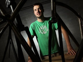 Calgary native Zak Pashak is photographed with some prototype bicycle frames in Detroit, Michigan on Friday, August 3, 2012. Pashak has founded the Detroit Bicycle company is hoping to build affordable mass produced bikes in the motor city.         TYLER BROWNBRIDGE/POSTMEDIA