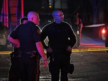 Police gather at the scene of an officer involved shooting in Dover in Calgary on Thursday night November 3, 2016.